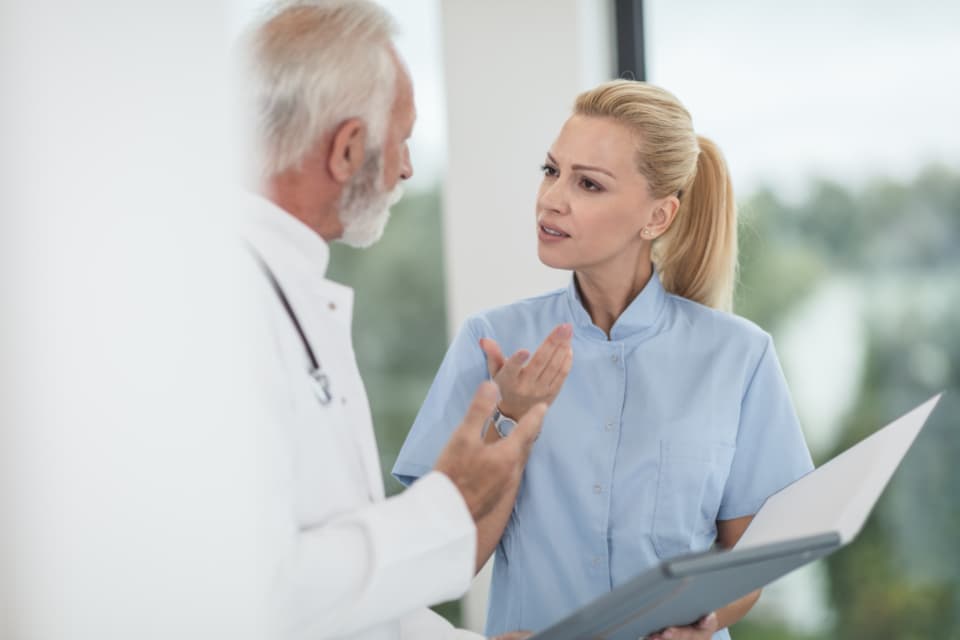 Medical professionals reviewing a patient chart